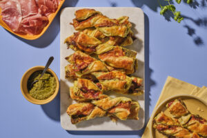 Cheesy Prosciutto and Pesto Puff Pastry Twists